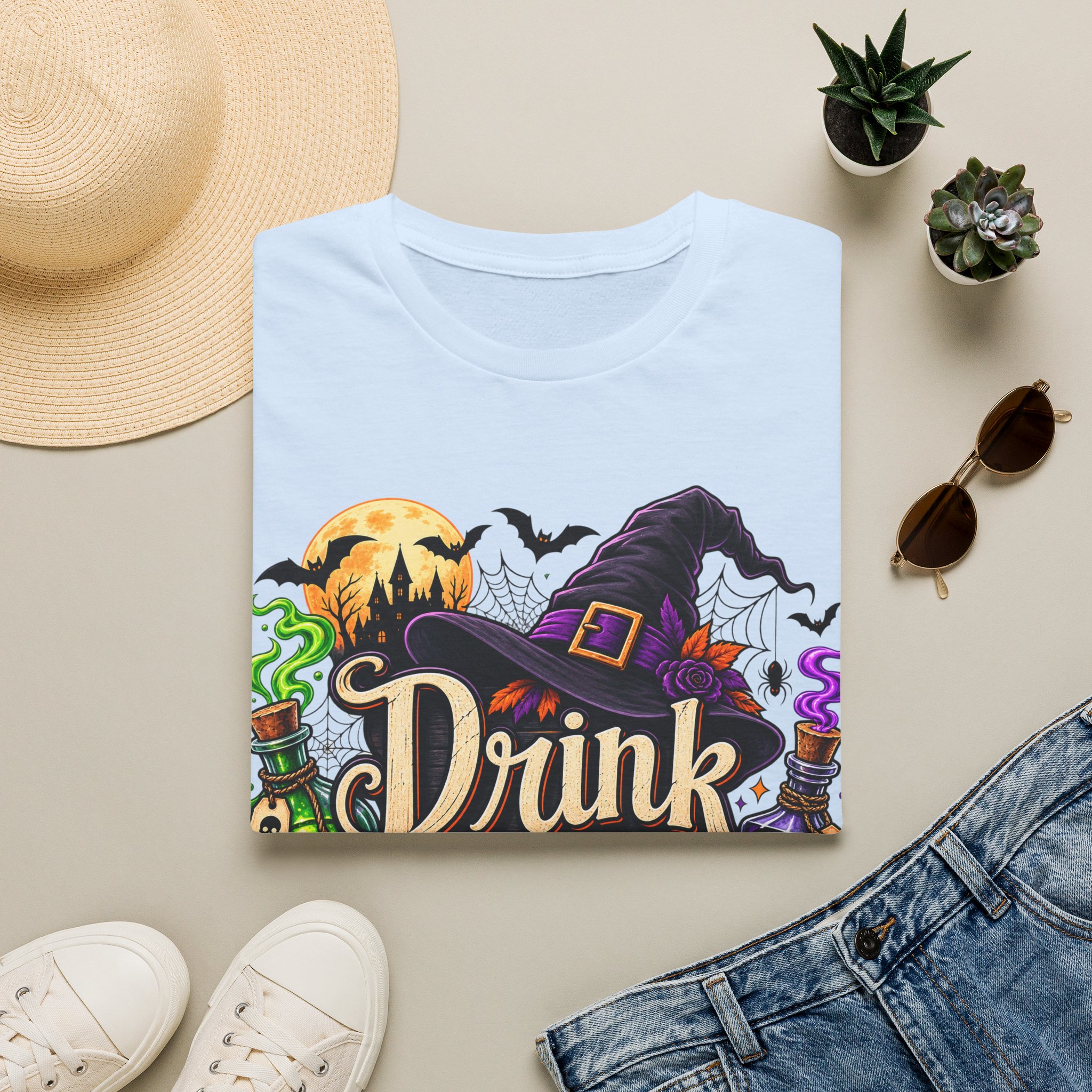 Close‑up of Drink Up Witches Halloween design with witch hat and cauldron