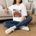 Model wearing More Boos Please Halloween T Shirt – cute ghost Halloween design