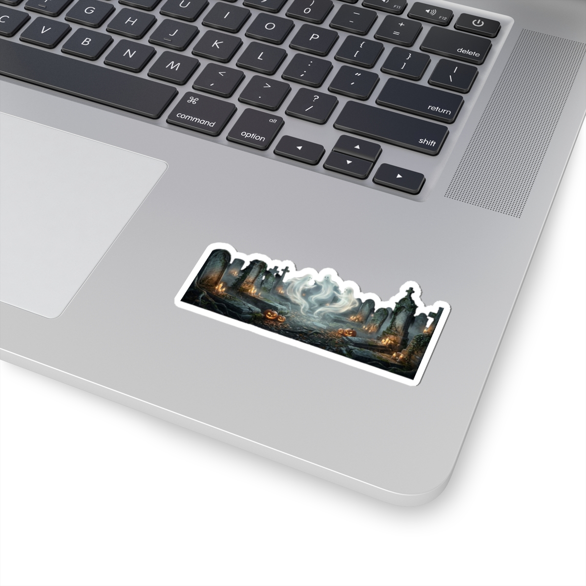 Kiss‑cut haunted graveyard sticker featuring glowing pumpkin, drifting ghost mist and eerie tombstones