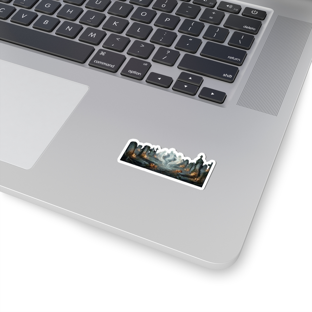 Kiss‑cut haunted graveyard sticker featuring glowing pumpkin, drifting ghost mist and eerie tombstones